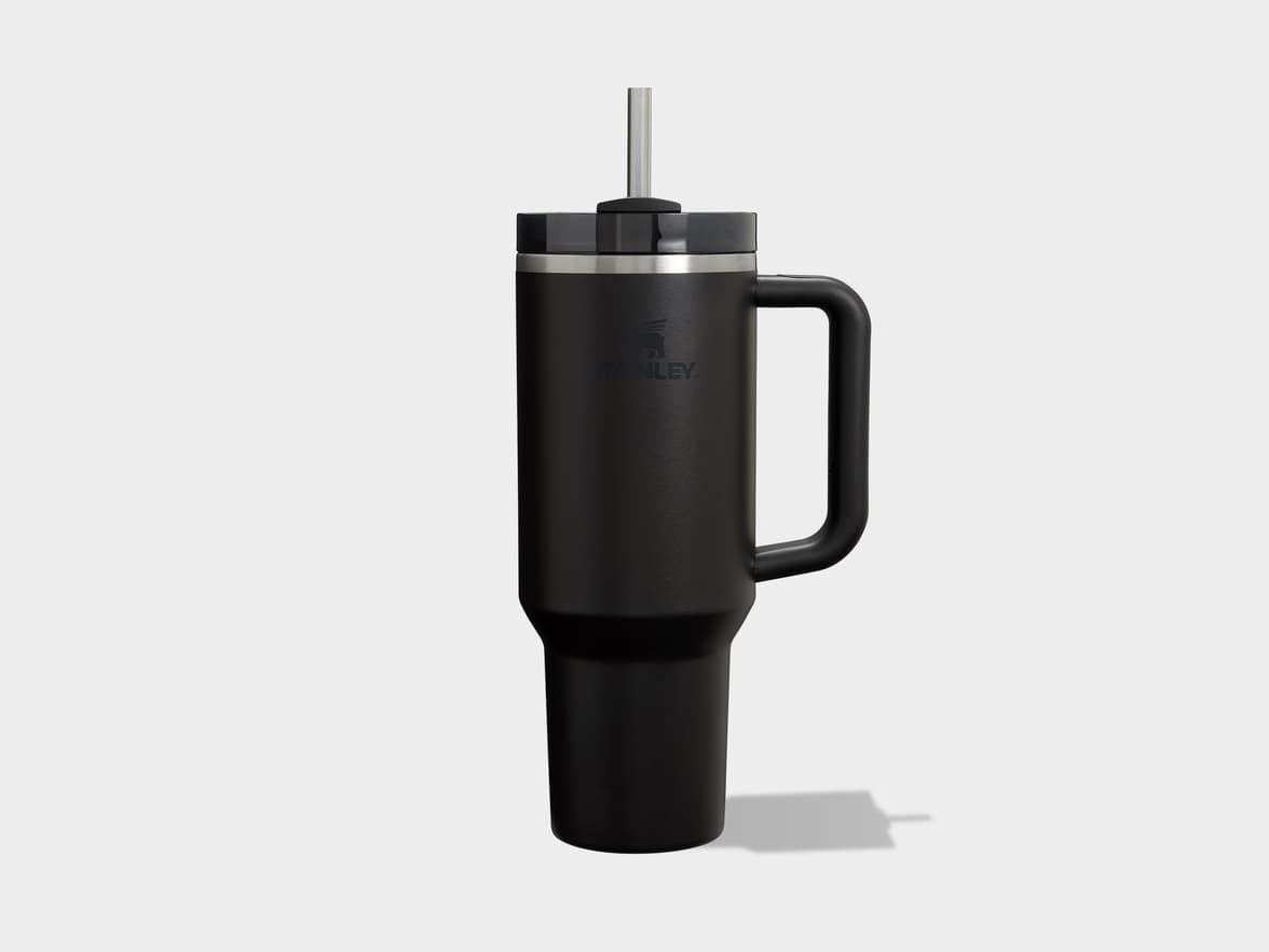 Black Stanley tumbler with handle and straw.