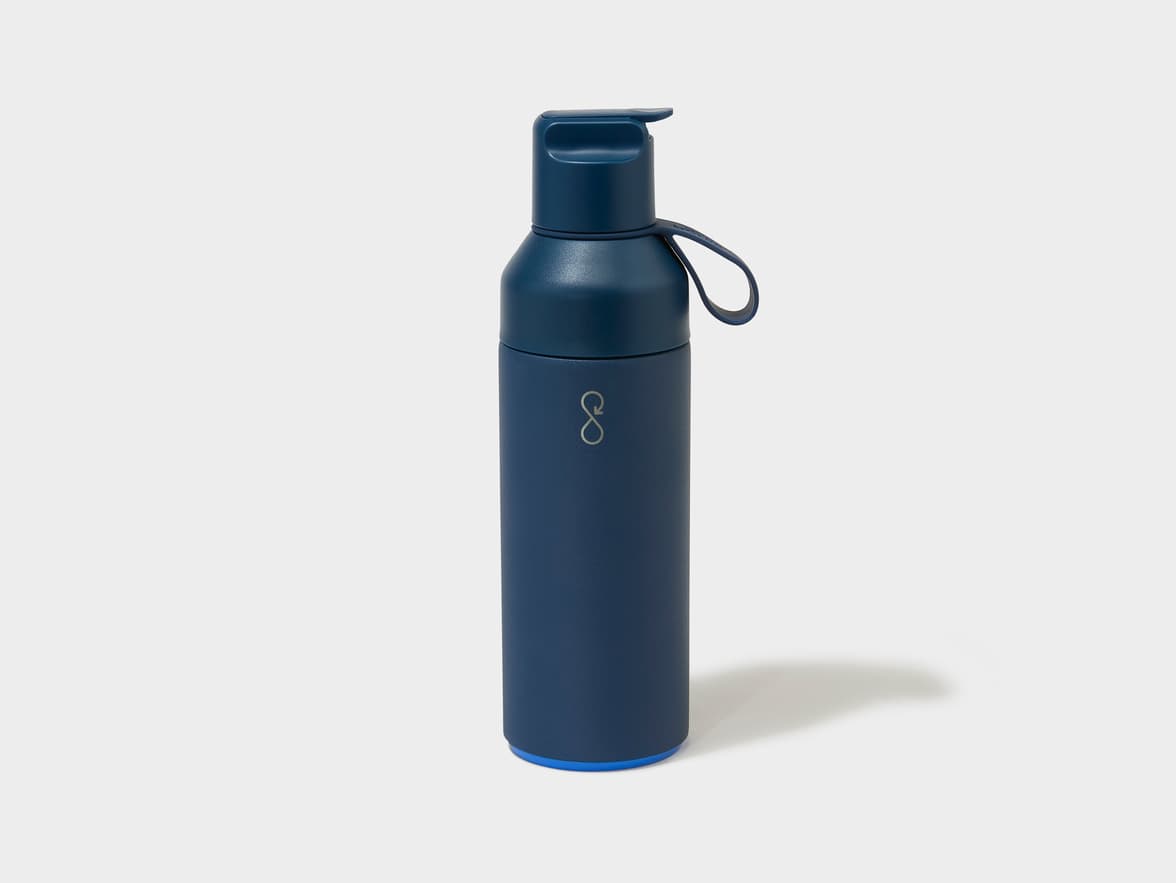 Dark blue water bottle with a flip-top lid and a silver infinity symbol logo.
