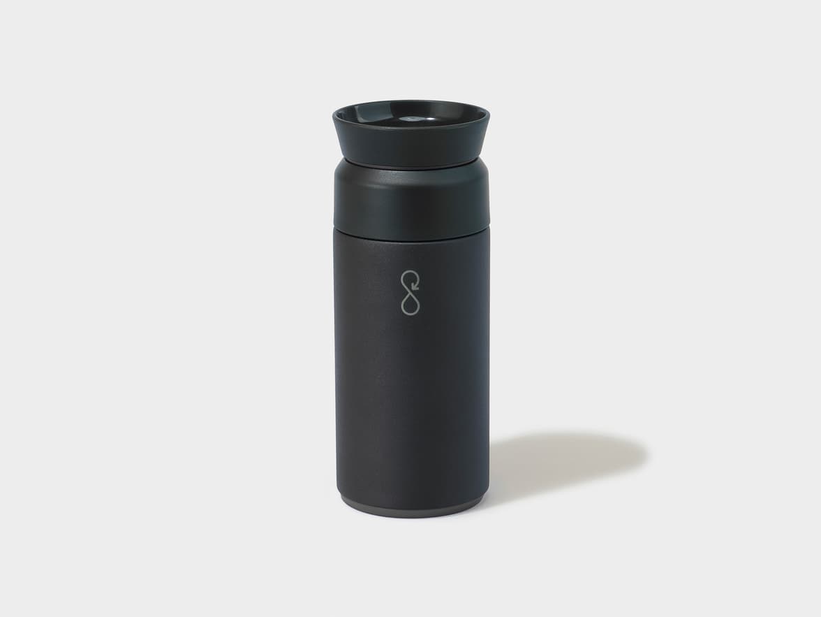 Black travel mug with a silver infinity loop logo on its side.