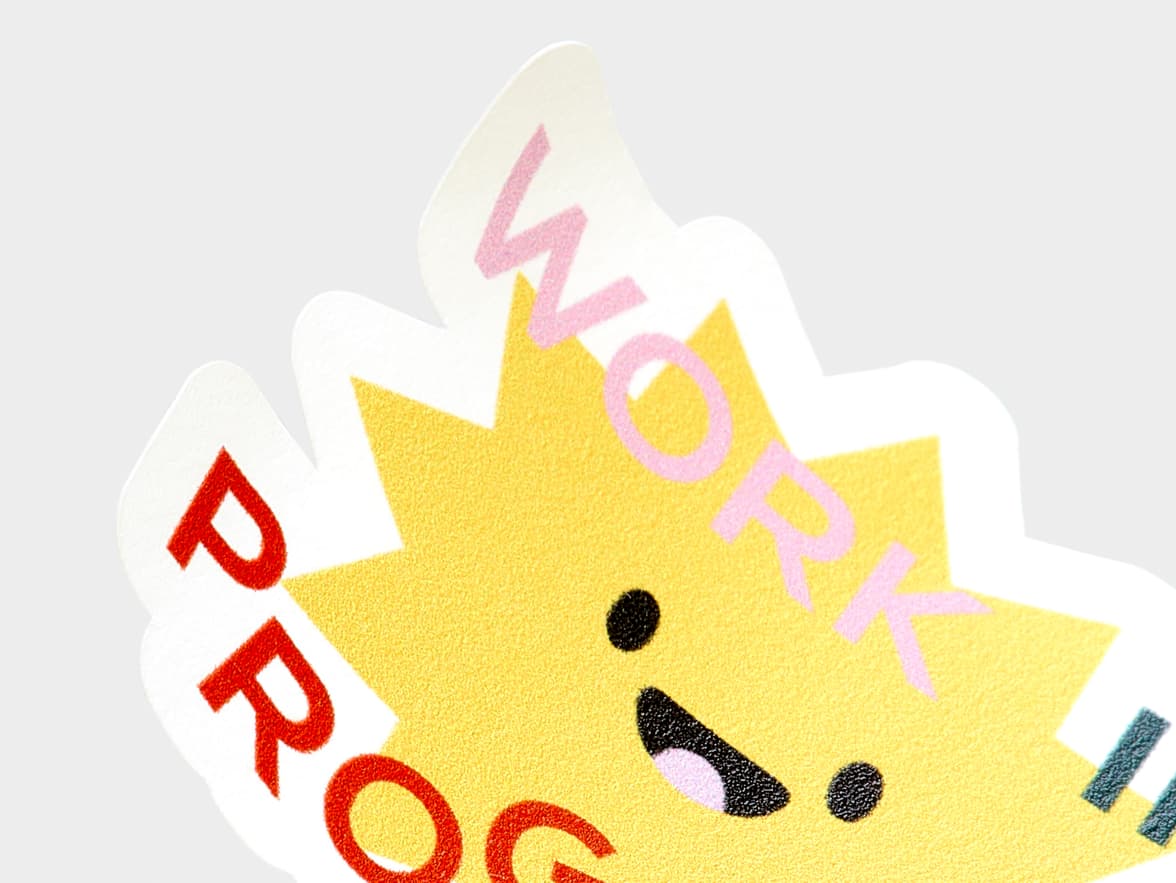 A close up of a customized star shape matte paper sticker.