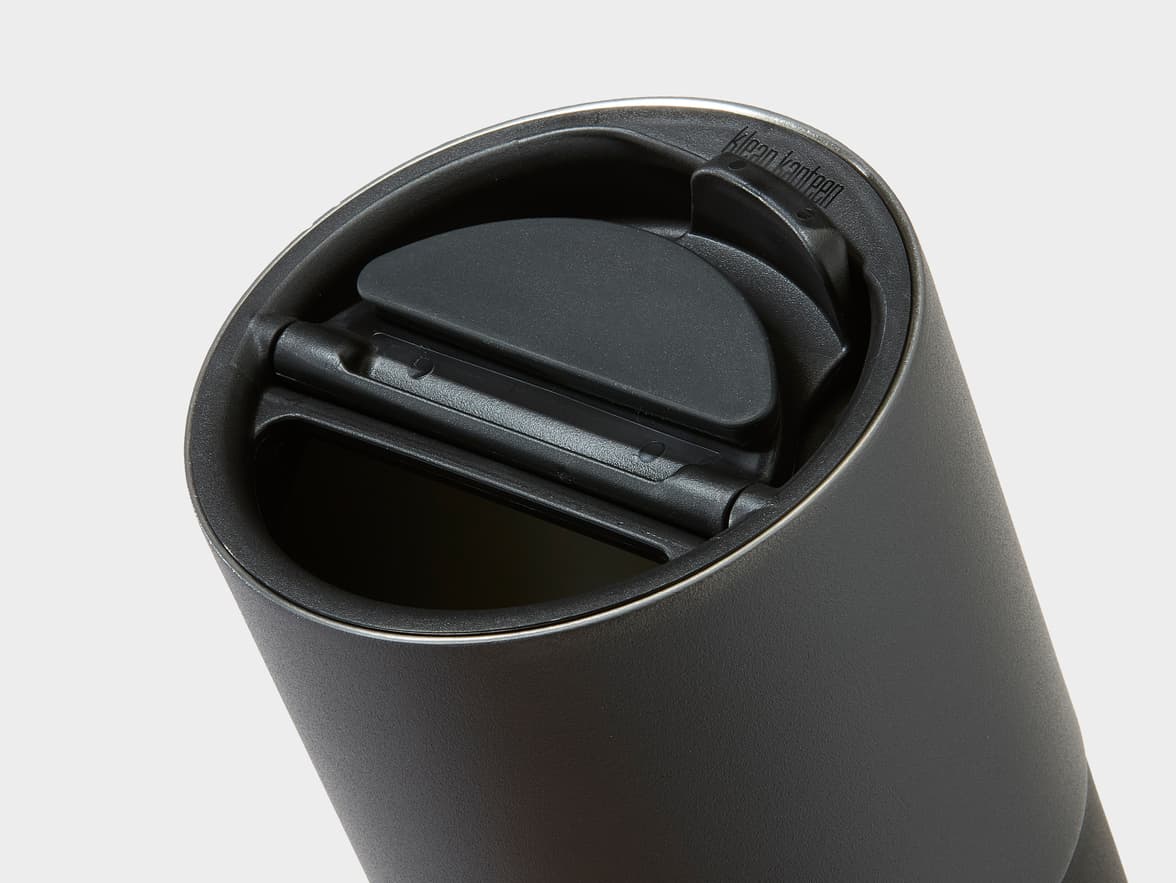 A black Klean Kanteen tumbler lid with a flip-up opening mechanism.