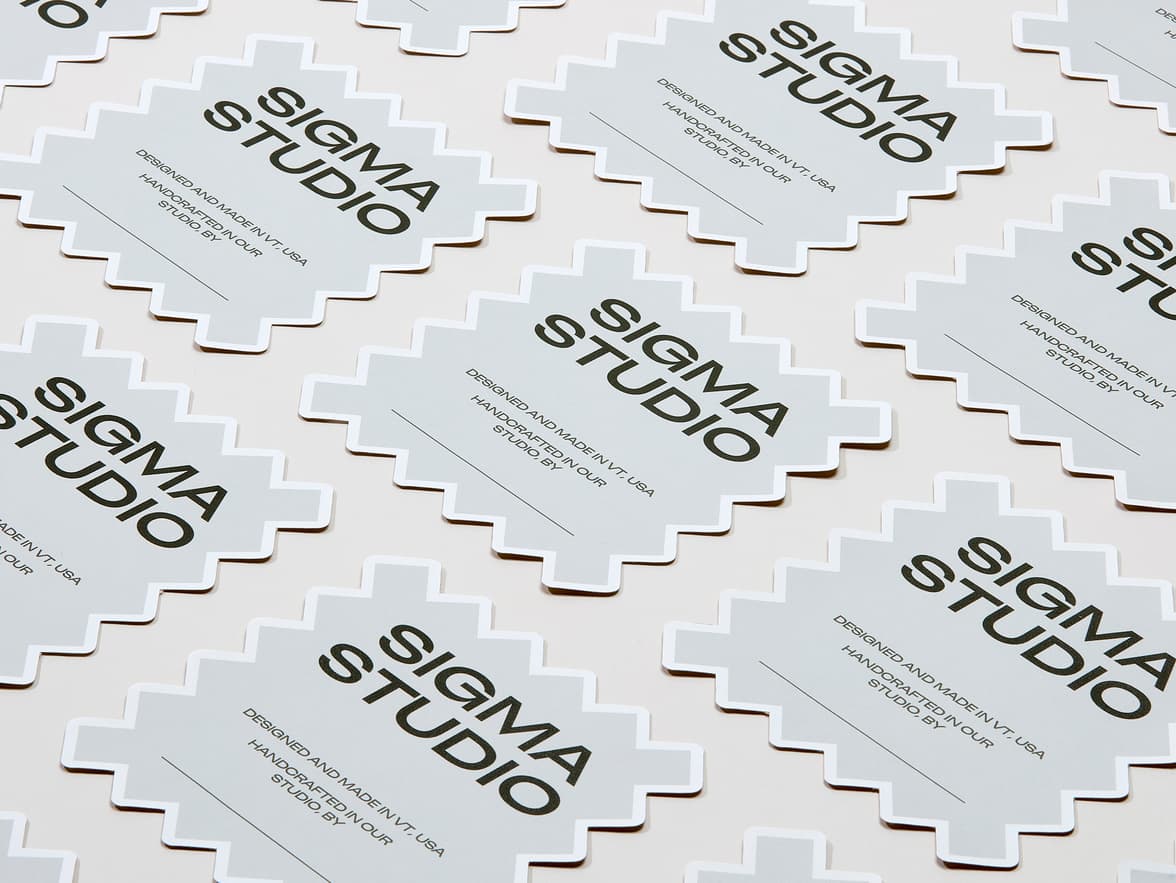 A collection of customized matte paper stickers in the shape of a square with jagged edges.