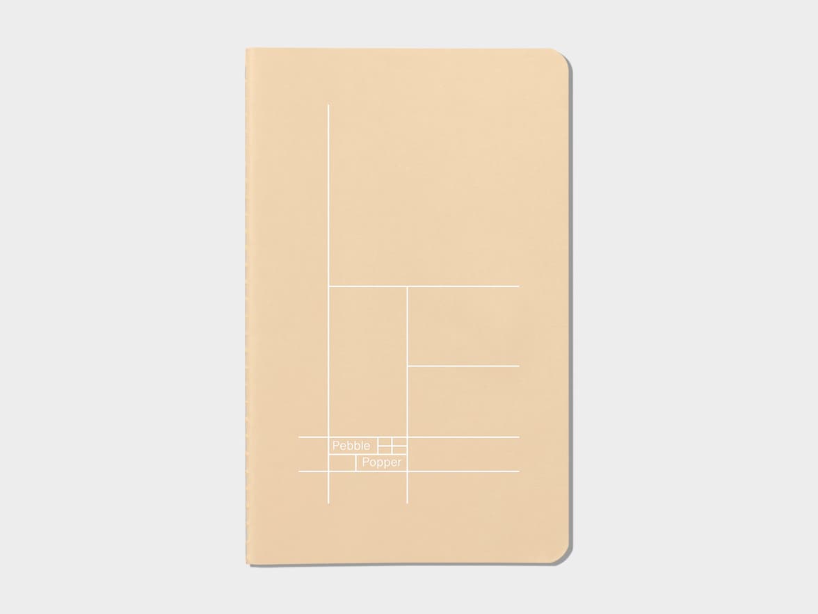Tan soft cover journal with white foil pattern