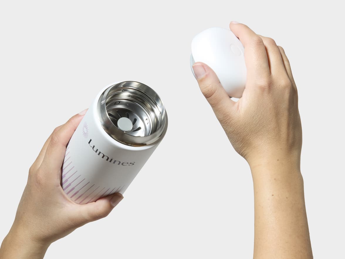 Hands Removing Lid From Matte White Fellow® Carter Move Mug With 360 Wrap Printing Customisation