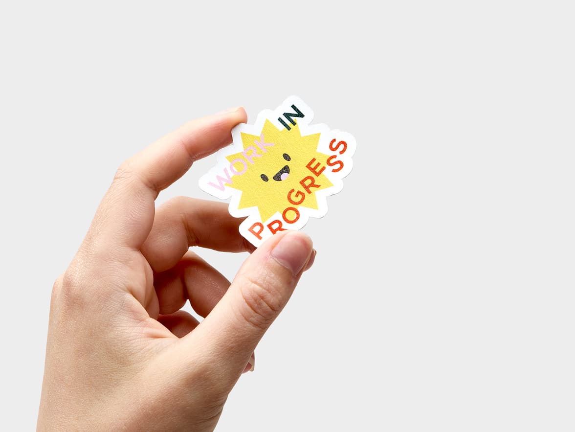 A customized sticker in the design and shape of a star with writing over it.