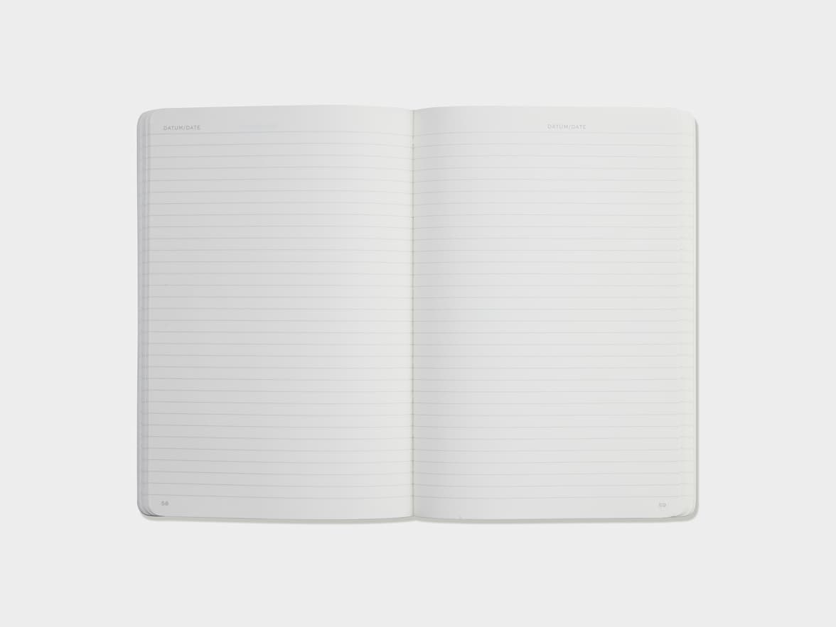 Open lined pages of a notebook