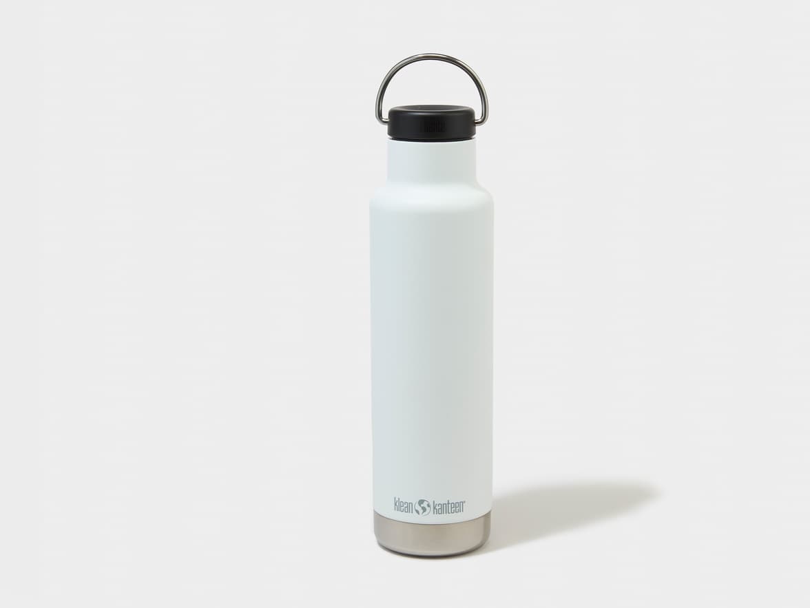 A white Klean Kanteen water bottle with a black cap and metal handle.