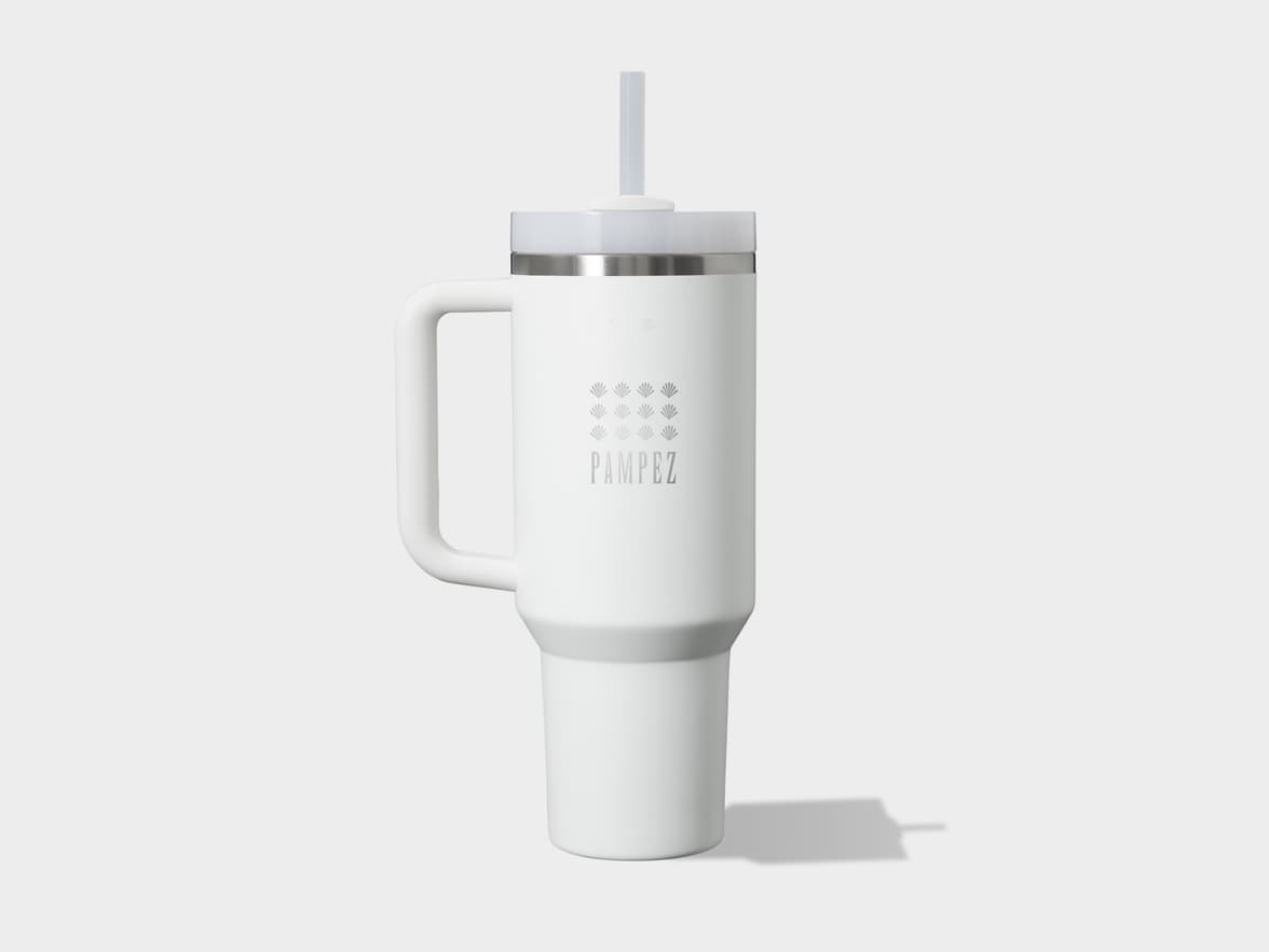 White PAMPEZ insulated tumbler with handle and straw on a light background.