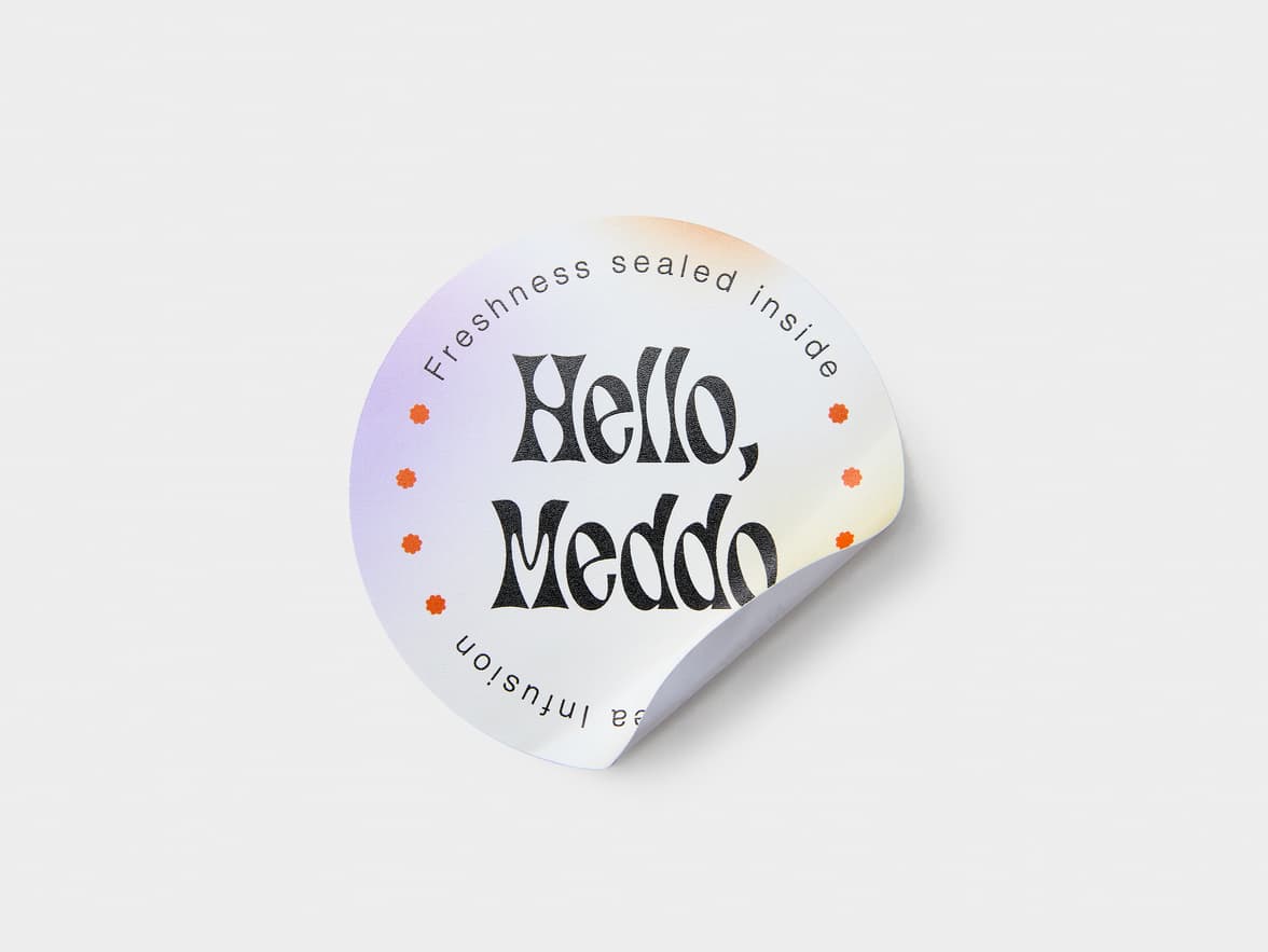 A multi coloured customized round coated sticker.