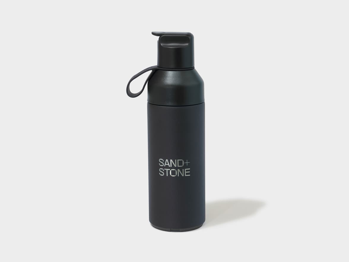 Black "SAND+ STONE" water bottle.