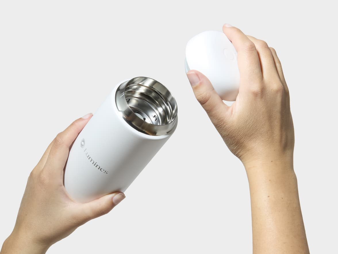 Hands Removing Lid From Matte White Fellow® Carter Move Mug With One-Sided Engraving
