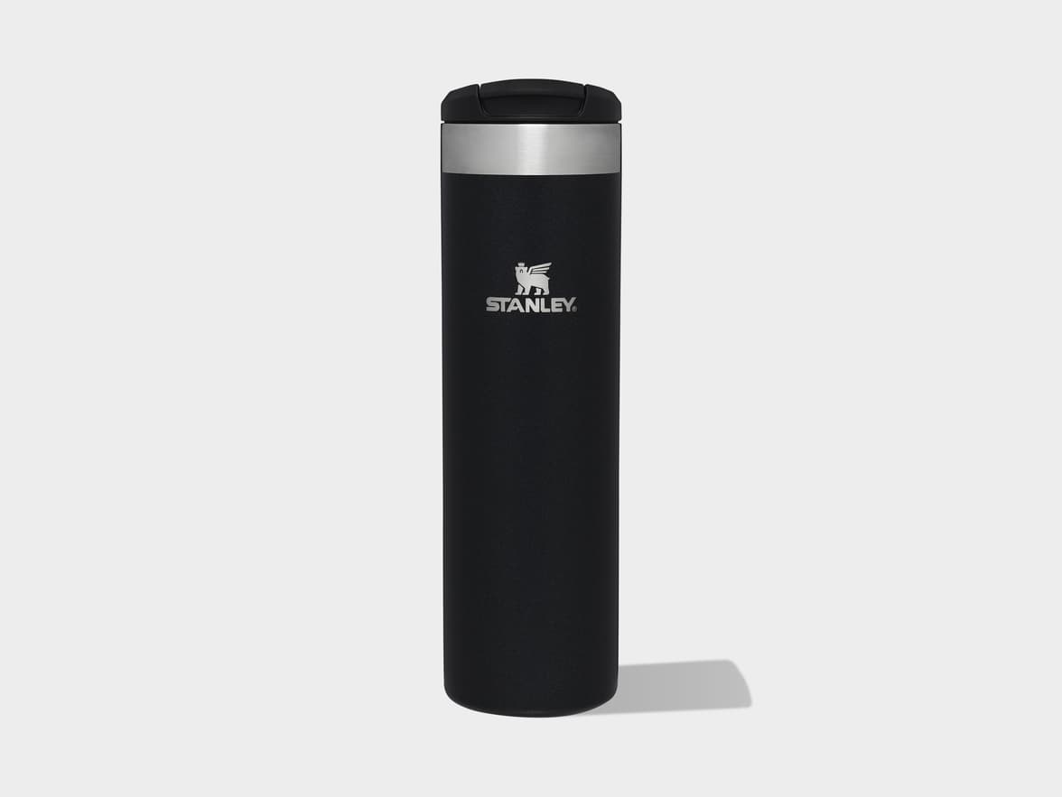 Black Stanley travel bottle with the Stanley logo and name on its side.