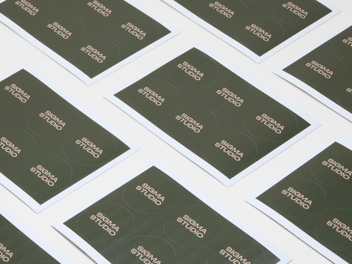 A collection of dark green customized round coated stickers.