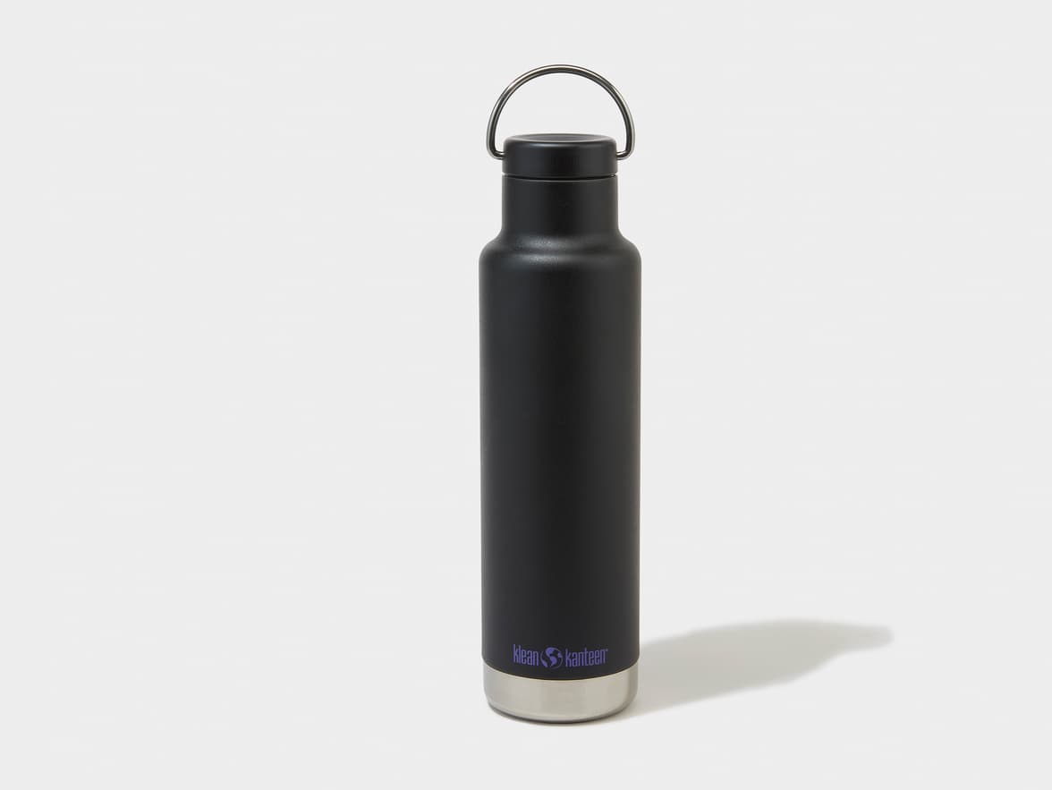 A black Klean Kanteen water bottle with a silver base and a loop handle on the cap.