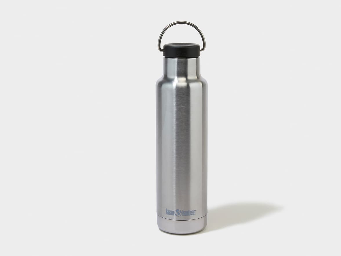 A silver Klean Kanteen water bottle with a black cap and metal carrying loop.