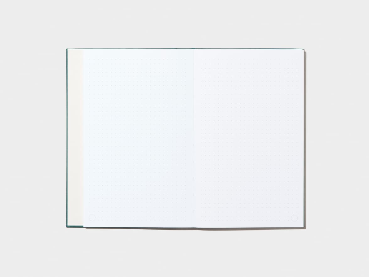 An opened Alpine Green Hardcover Notebook with dotted pages 