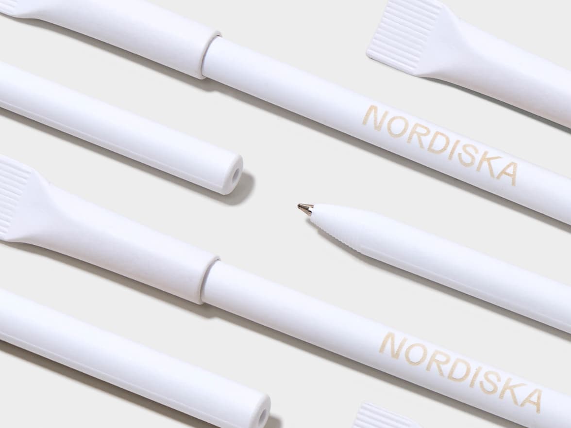 White NORDISKA pens arranged diagonally, one showing its tip and others with brush-like ends or caps.