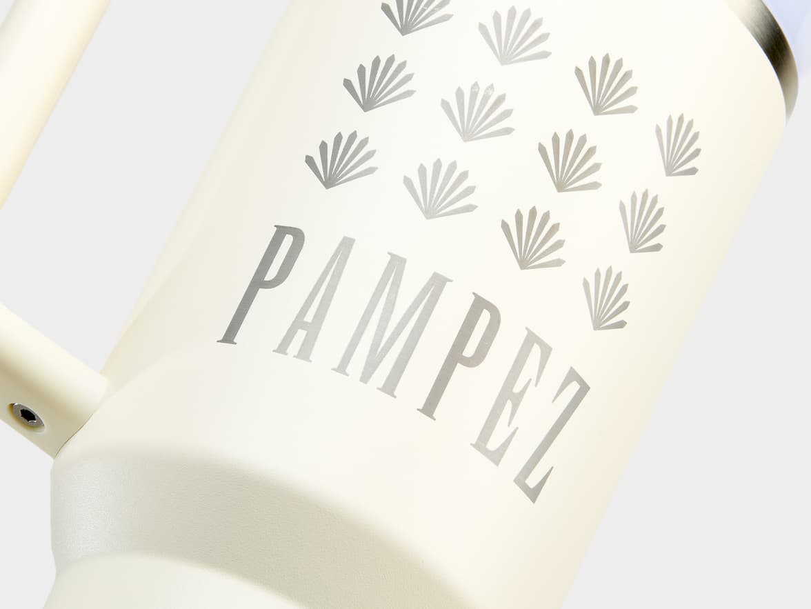 Cream bottle with "PAMPEZ" text and silver fan designs.
