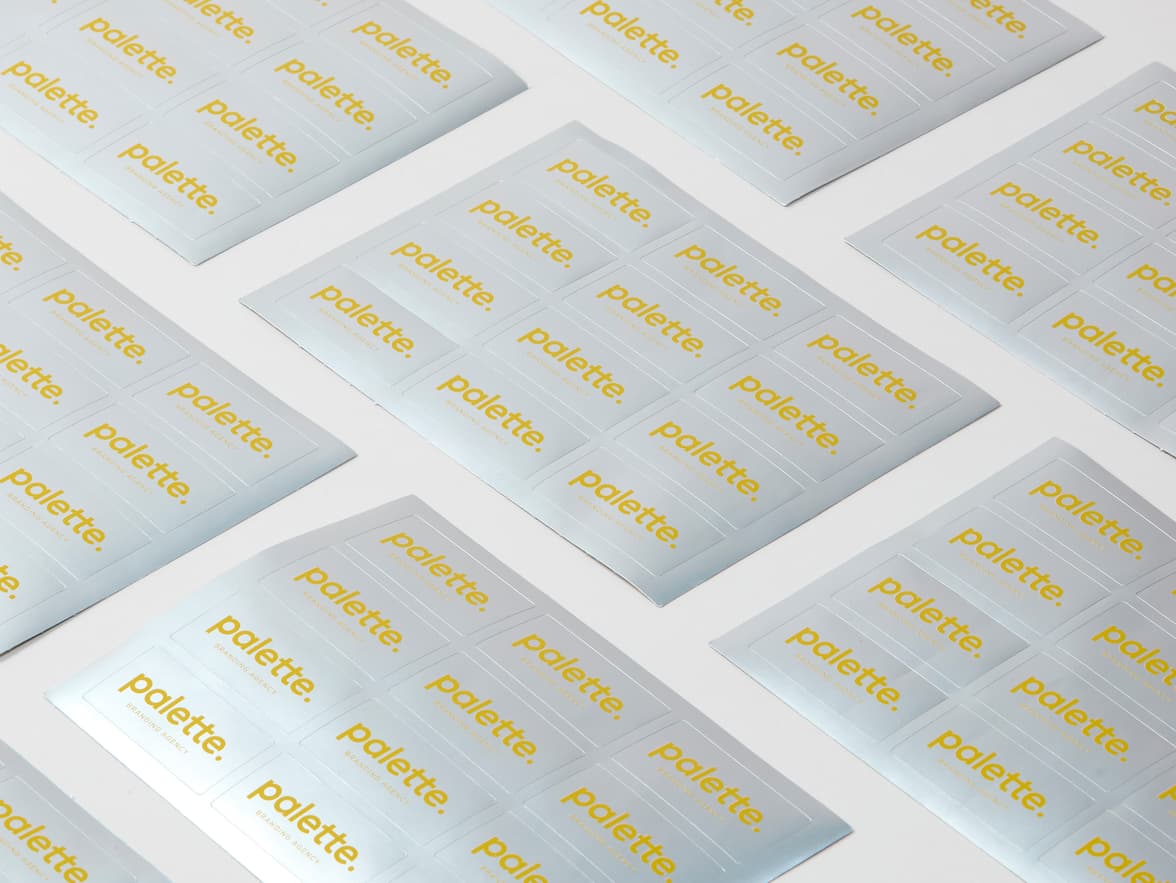 A collection of silver rectangular stickers with yellow customization.