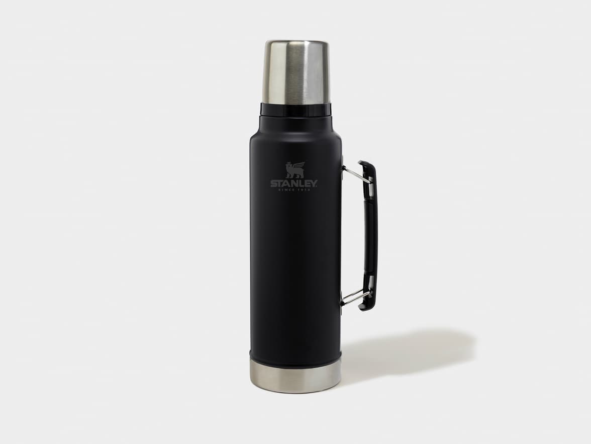 Black Stanley thermos with a silver top and base, featuring the STANLEY SINCE 1913 logo.
