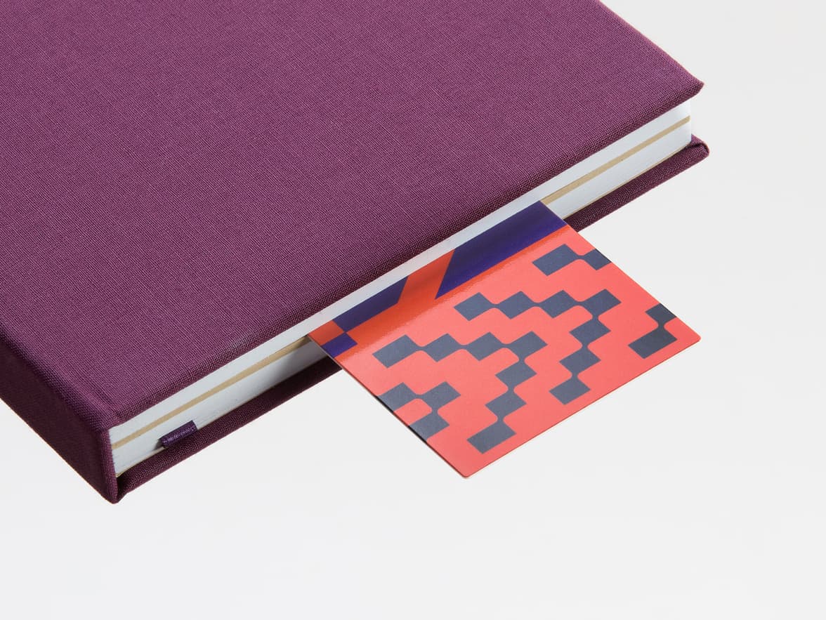 High gloss bookmark sticking out of book.