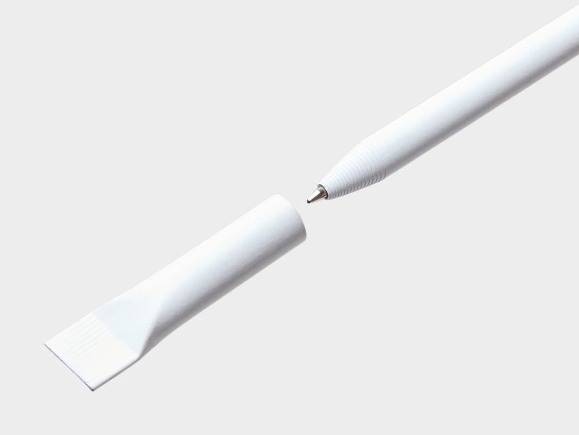 A white pen with a ribbed grip section and a metal tip, separated from its white cap which has a flat, spatulate end.