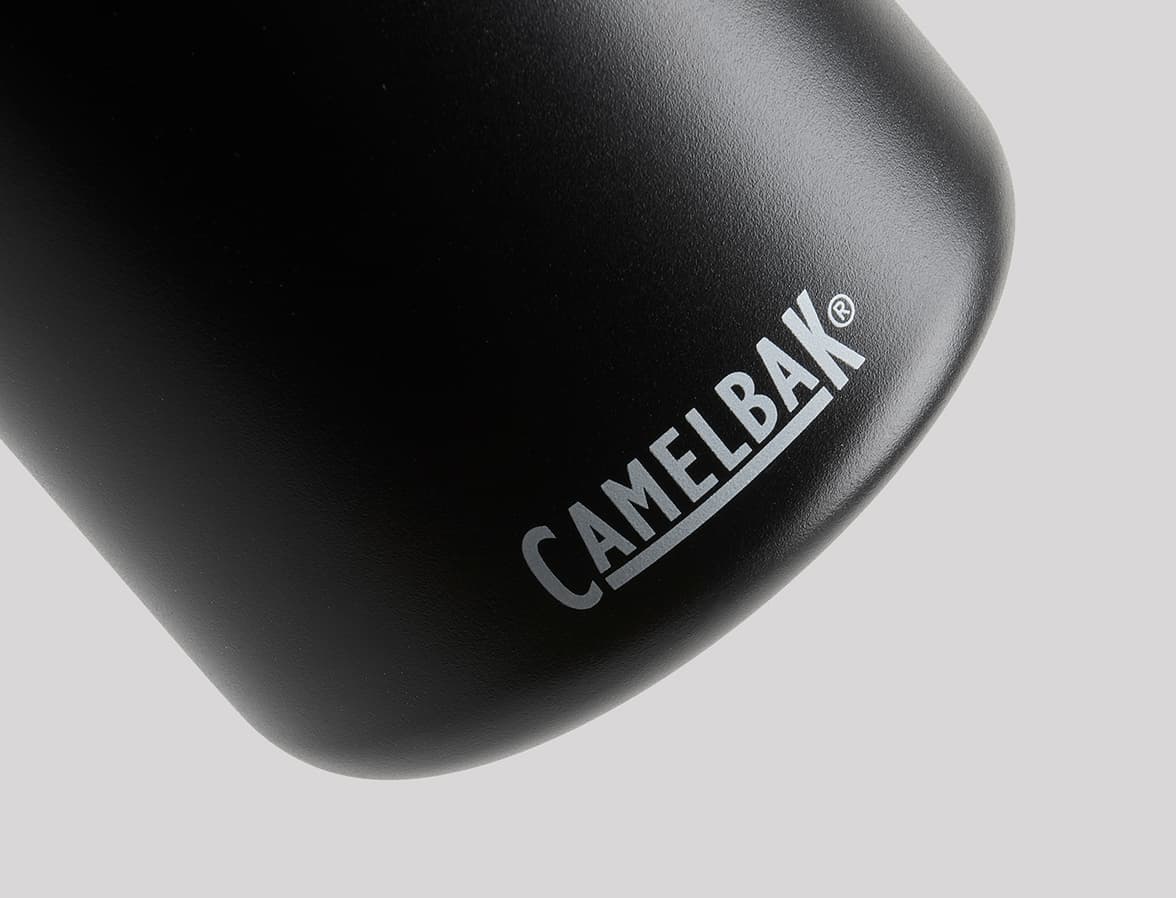 A close up image of the bottom of a black water bottle with CamelBak branding.