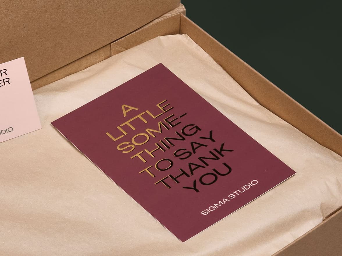 postcard with gold foil with the message of 'a little something to say thank you' displayed in a box