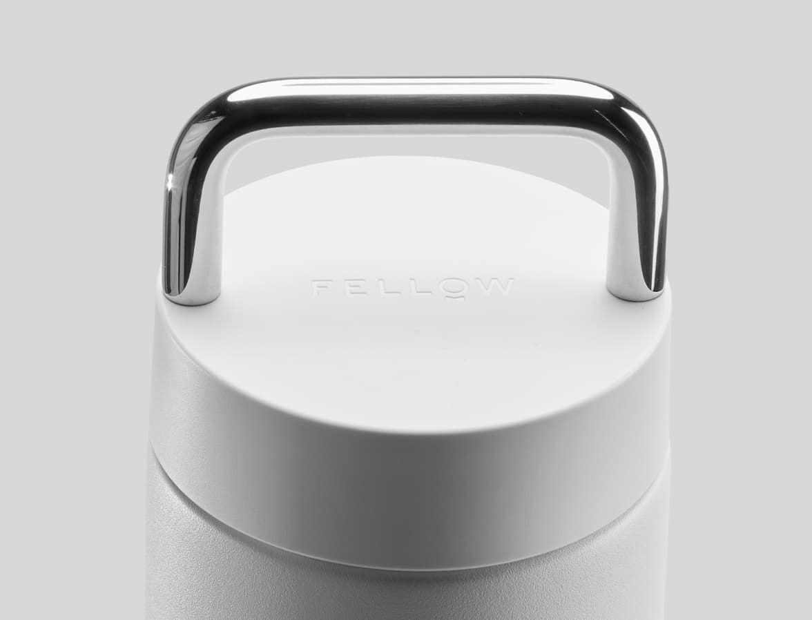 A close up of the top of a white tumbler lid